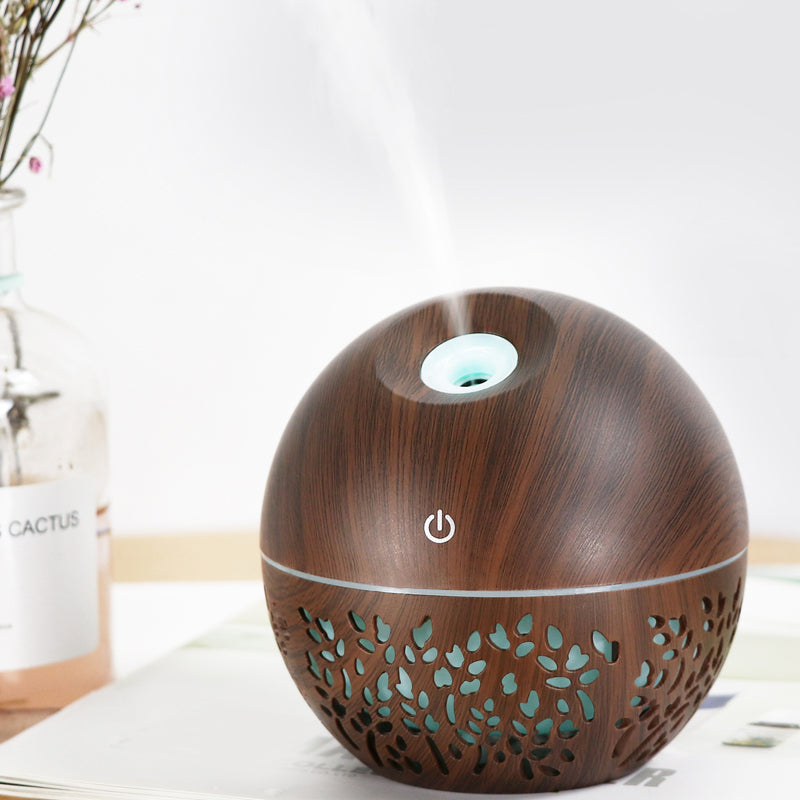 Wooden-patterned diffuser on a white surface with a light background