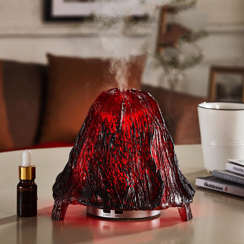Red and black lava lamp-style diffuser on a table with a blurred background