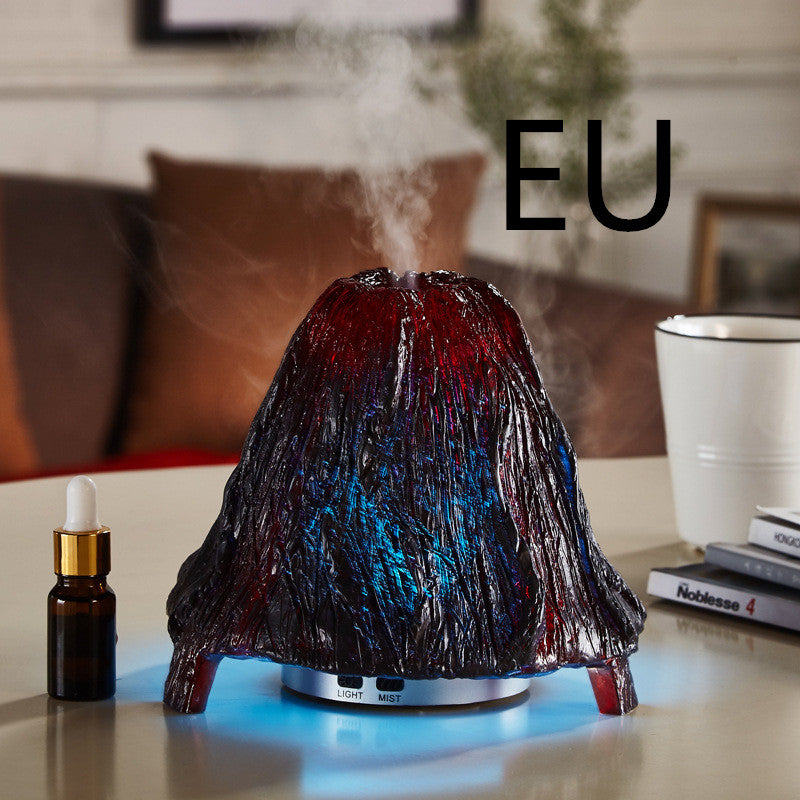 Decorative humidifier shaped like a volcano on a table with 'EU' text above.