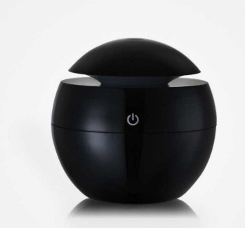 Black spherical device with a power symbol on a white background