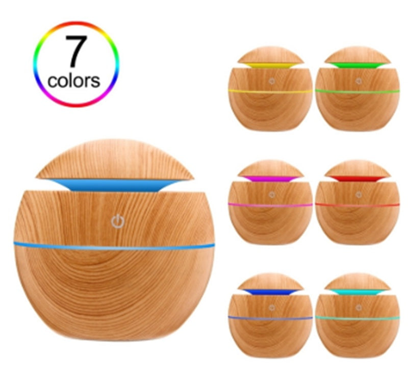 Wooden diffuser with LED lights showing 7 color options on a white background