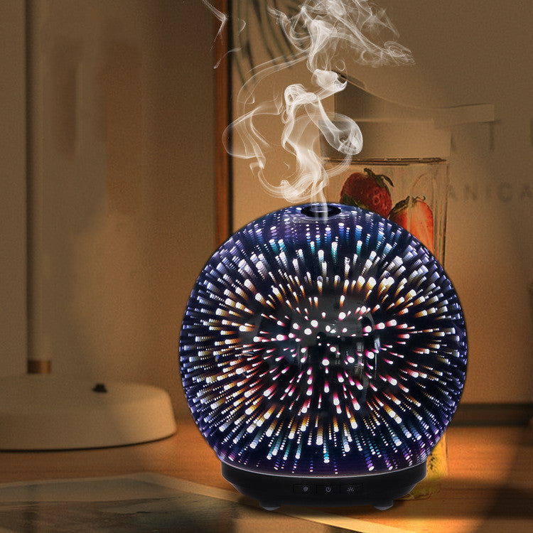 Colorful diffuser emitting mist on a wooden surface with a blurred background
