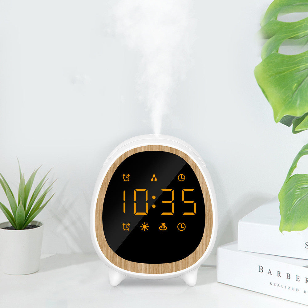 Digital clock with wooden border on a white surface with plants and books in the background