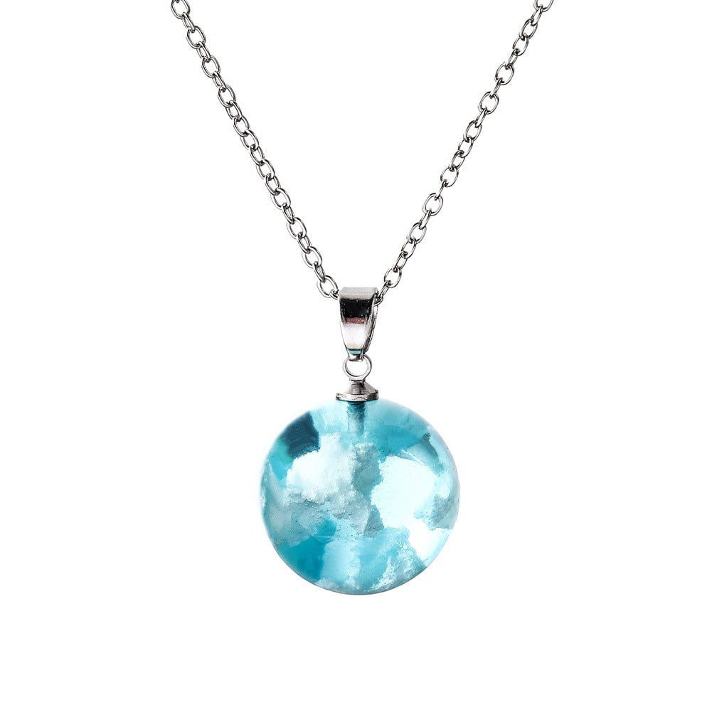 Necklace with a blue pendant on a white background