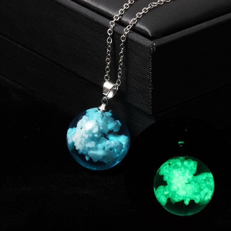 Necklace with a glowing pendant on a dark background