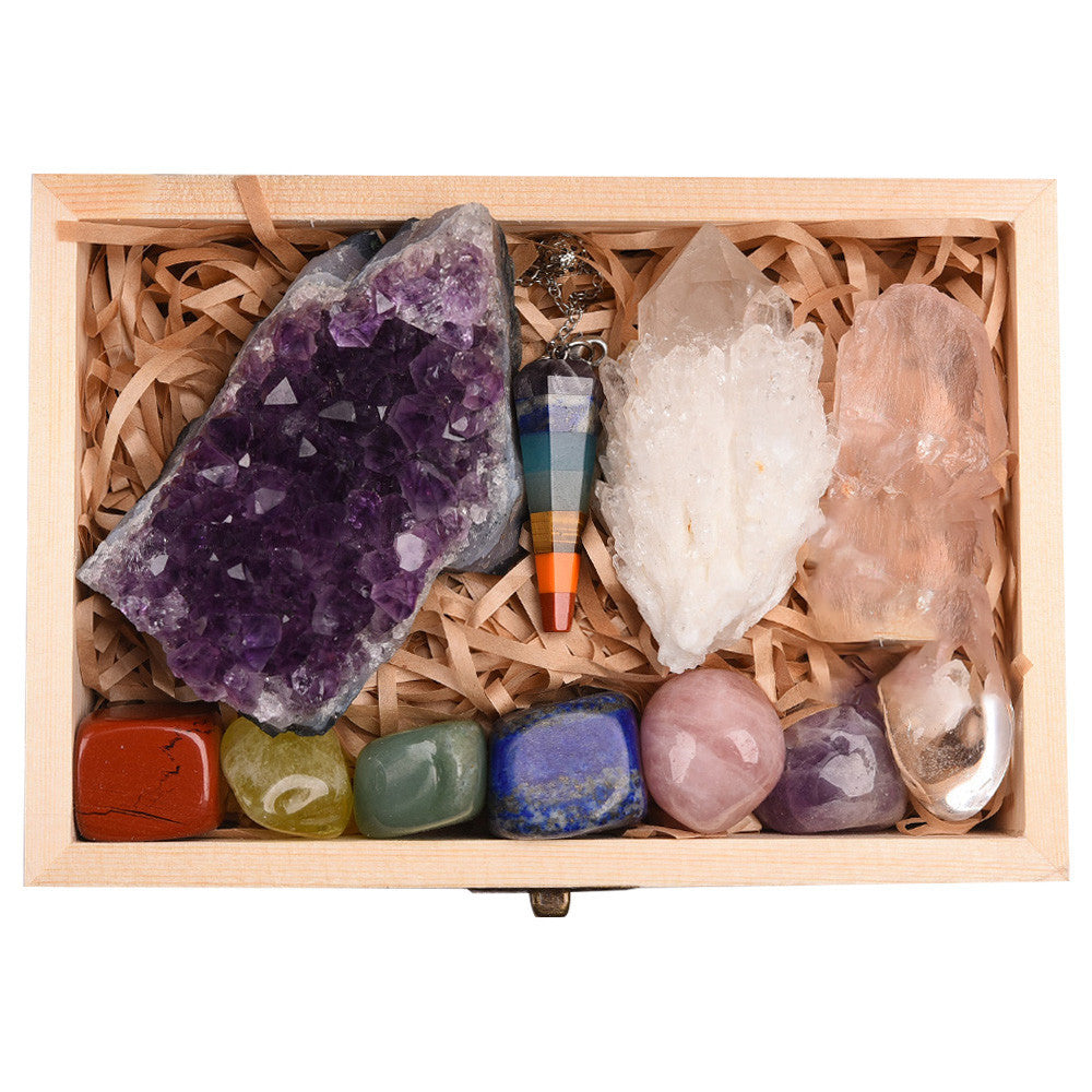 Collection of crystals and a crystal necklace in a wooden box