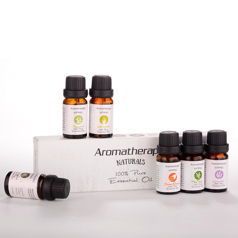 Set of Aromatherapy Naturals essential oil bottles on a white background