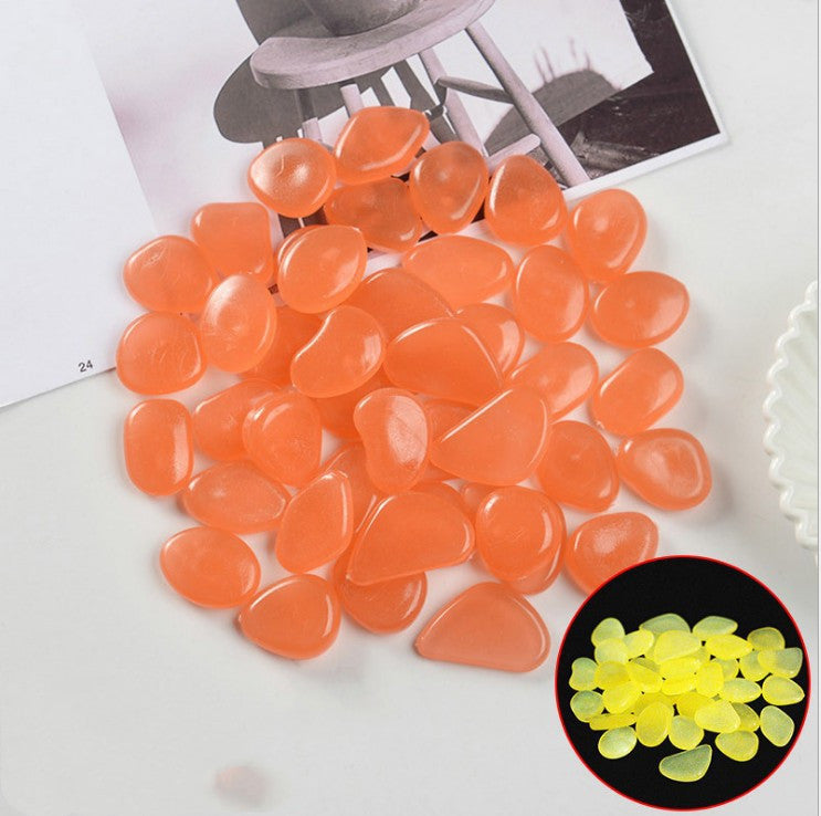 Orange teardrop-shaped beads with a close-up inset showing yellow glow-in-the-dark beads.