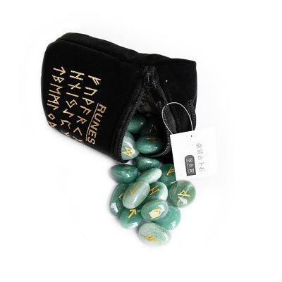 Green rune stones spilling out of a black pouch with gold text on a white background