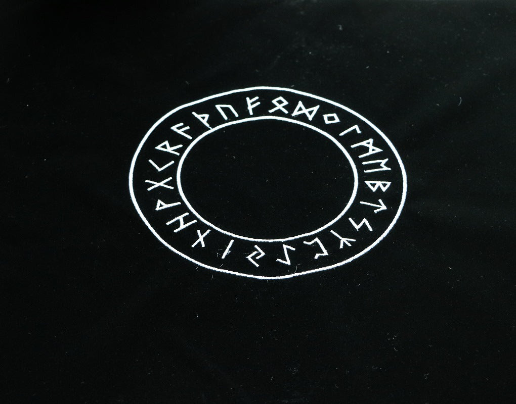 Runic inscription on a black background
