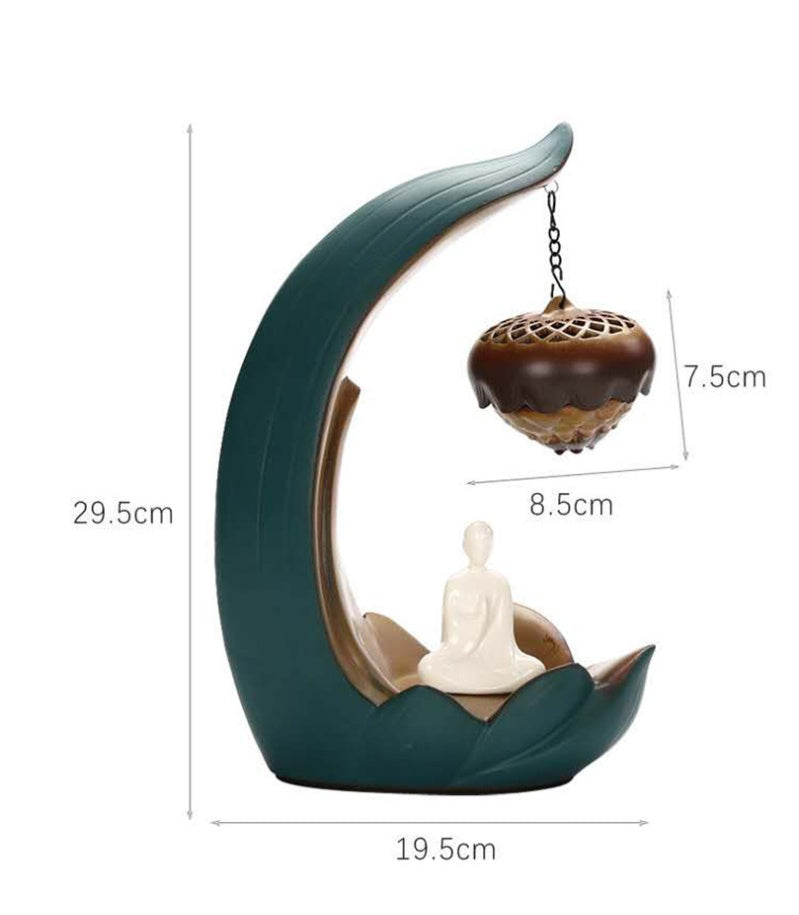 Decorative incense burner with a Buddha figure and measurements on a white background
