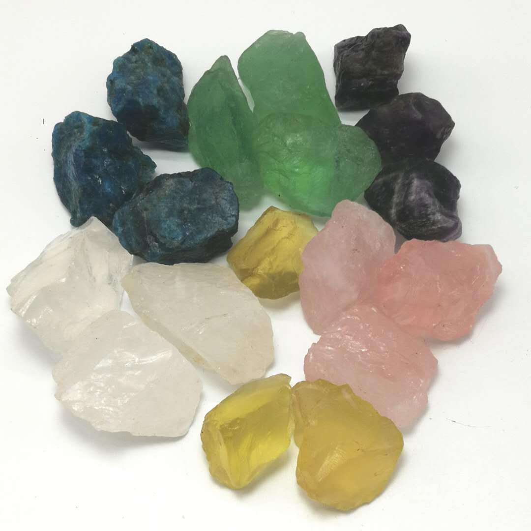 Assorted colored crystals on a white background