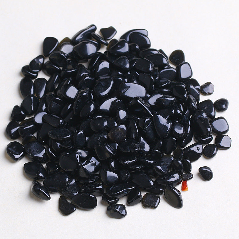 Pile of black pebbles on a white background