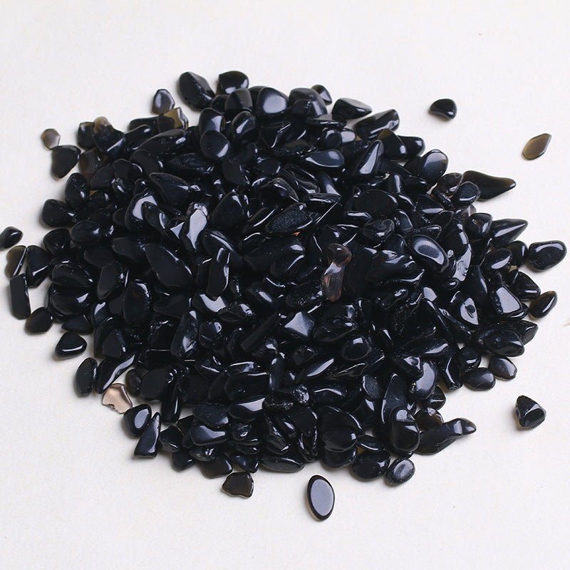 Pile of black pebbles on a white background