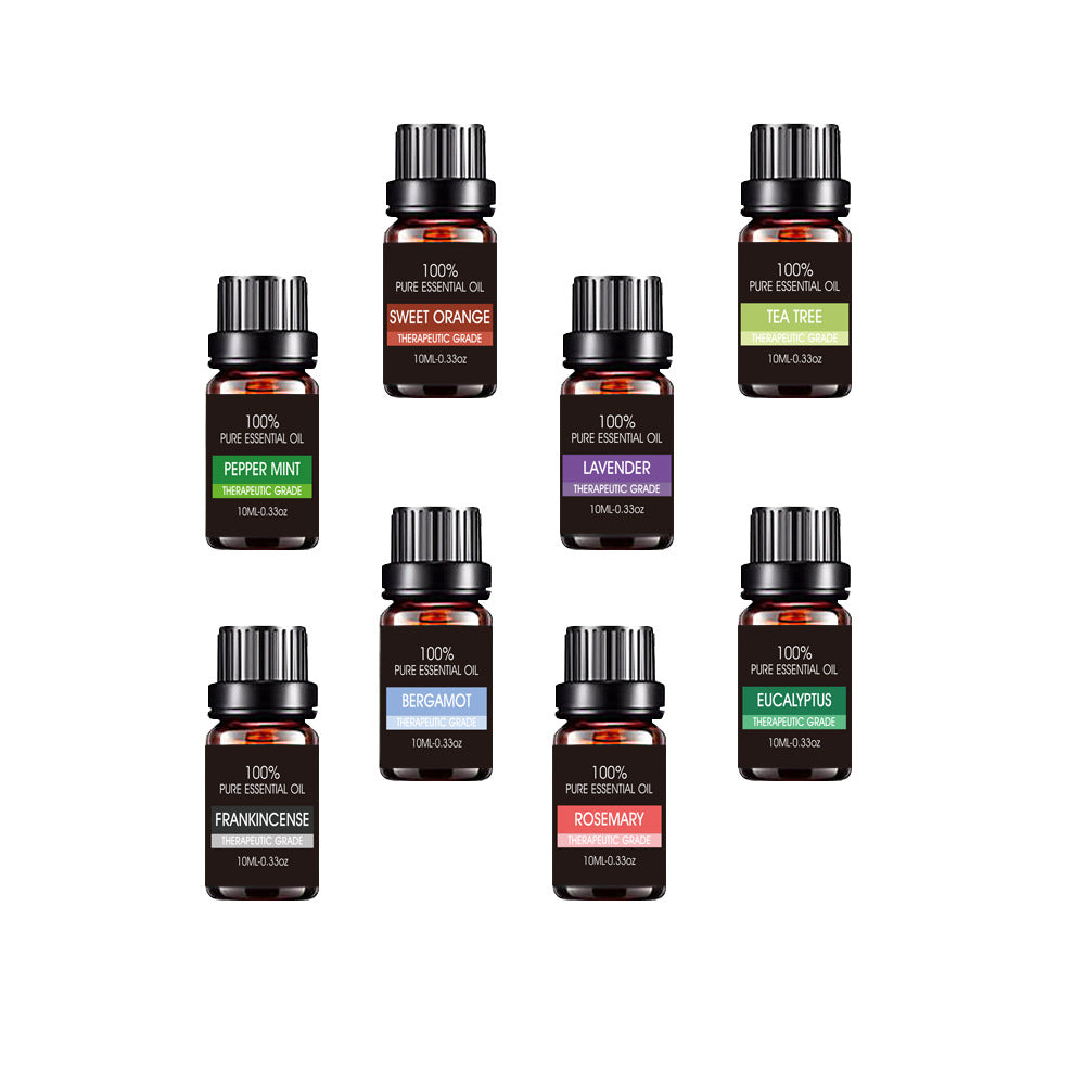 Collection of essential oil bottles with labels on a white background