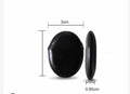 Black button with measurements on a white background