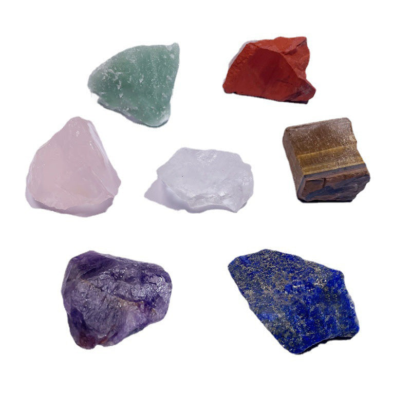 Collection of various colorful crystals on a white background