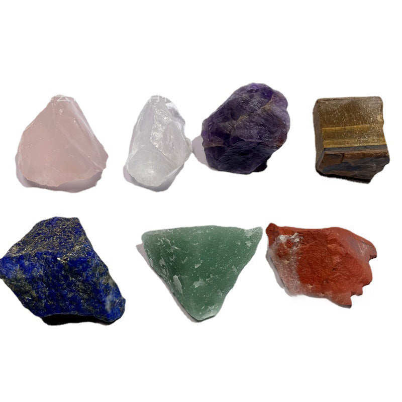 Collection of various colored crystals on a white background