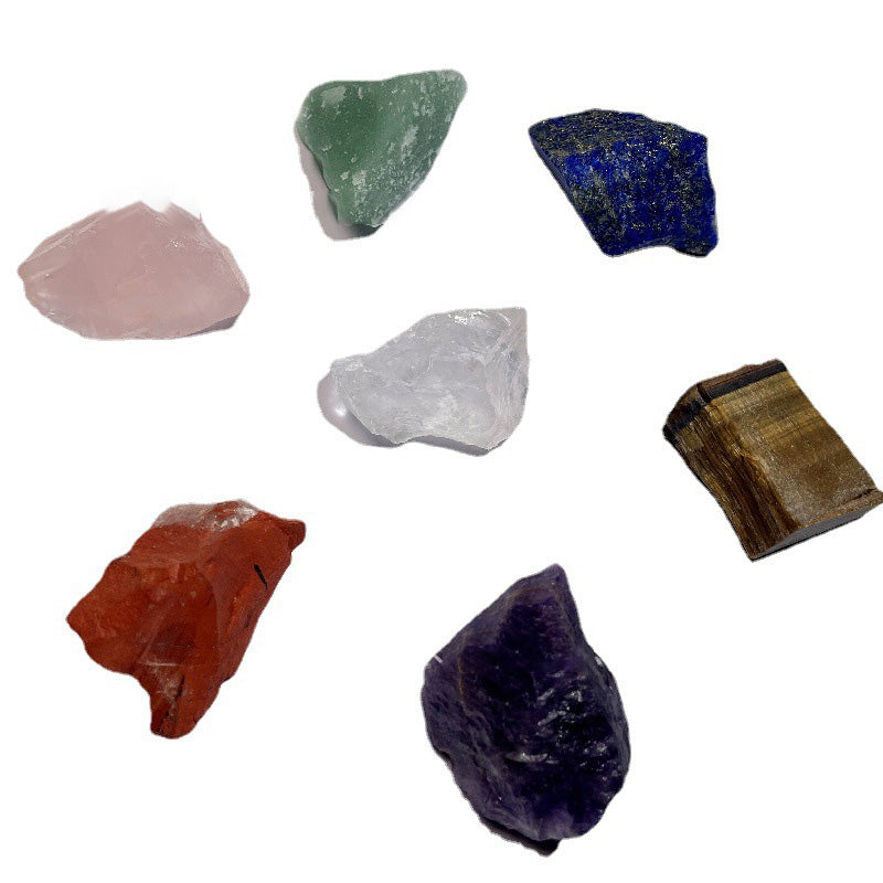 Collection of various colorful crystals on a white background