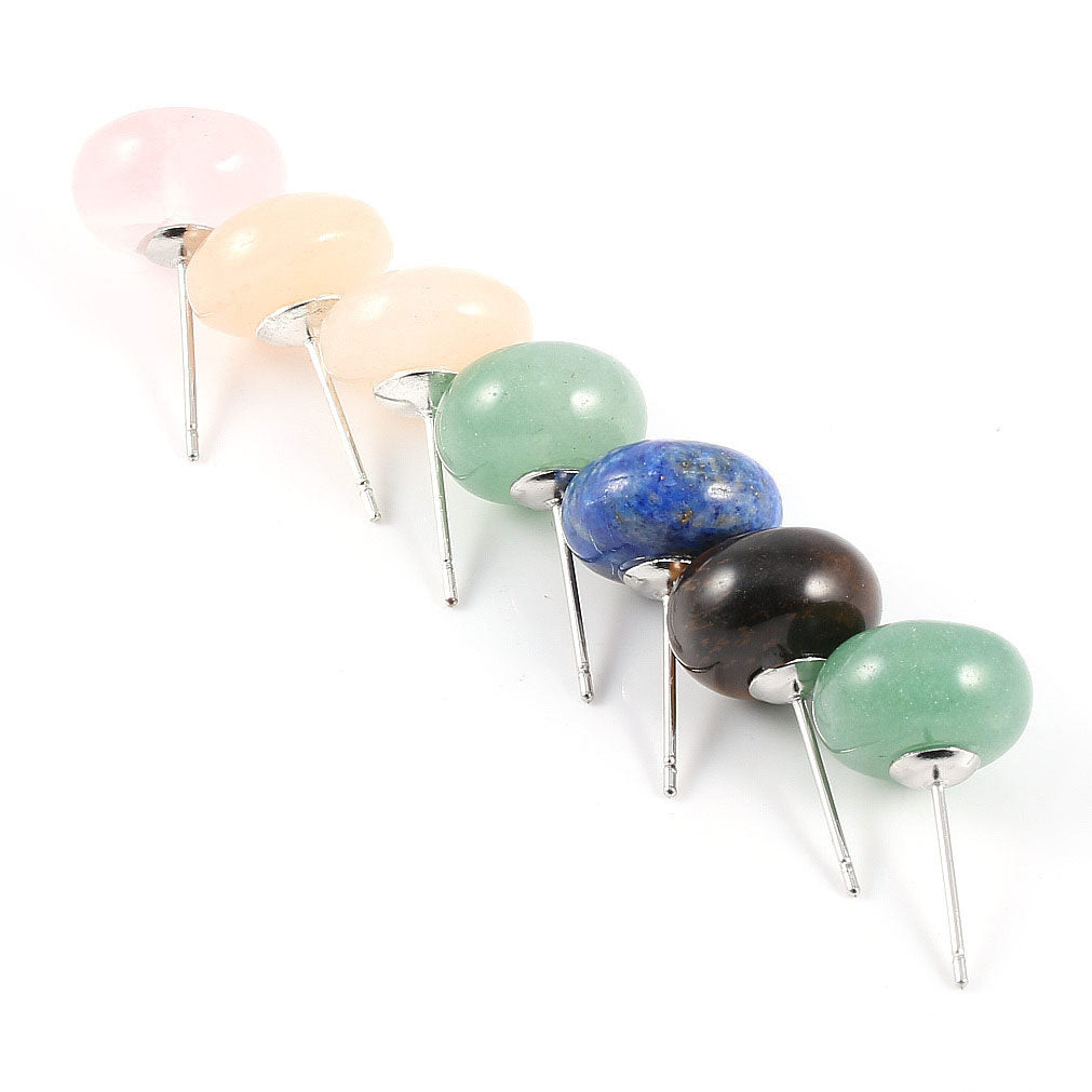 Set of colorful gemstone hair pins on a white background