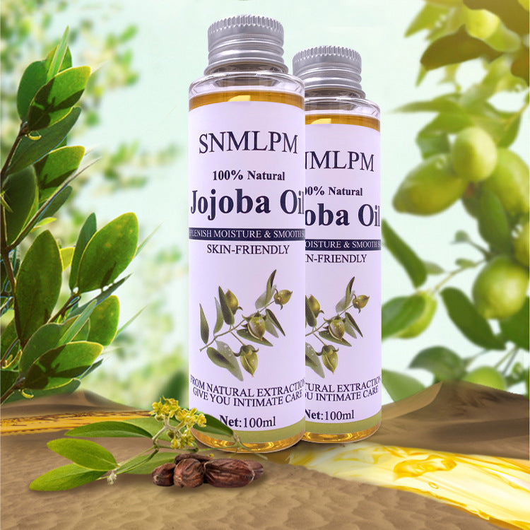 Two bottles of SNMLPM Jojoba Oil with a natural background