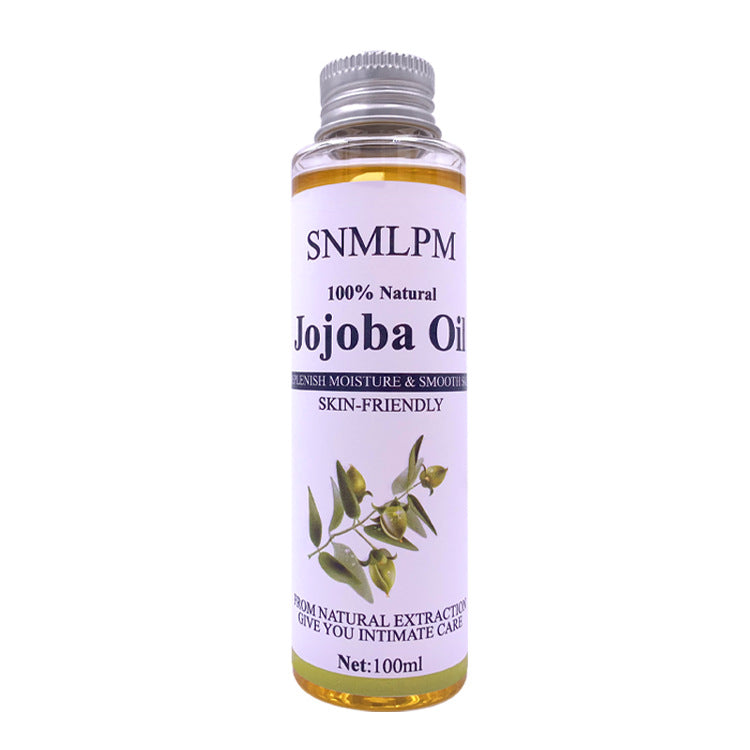 Bottle of SNMLPM Jojoba Oil on a white background