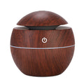 Wooden-textured humidifier with power symbol on a white background
