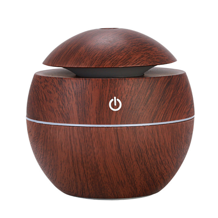 Wooden-textured humidifier with power symbol on a white background