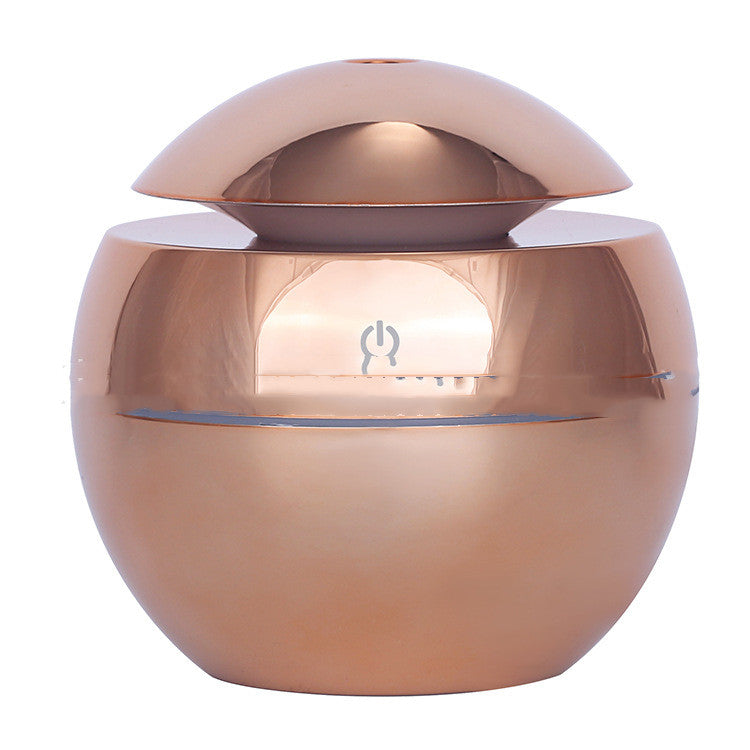 Rose gold container with a lid on a white background