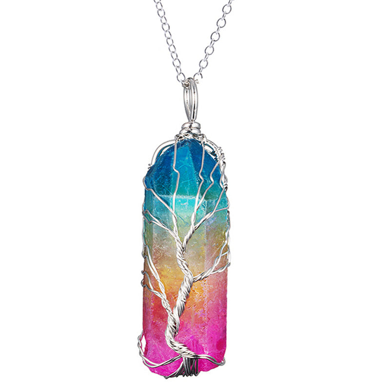 Multicolored crystal pendant with silver tree design on a white background