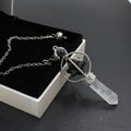 Necklace with crystal pendant on a dark surface