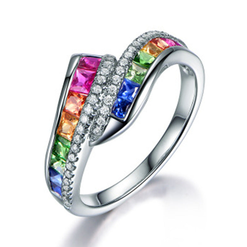 Ring with colorful gemstones on a white background