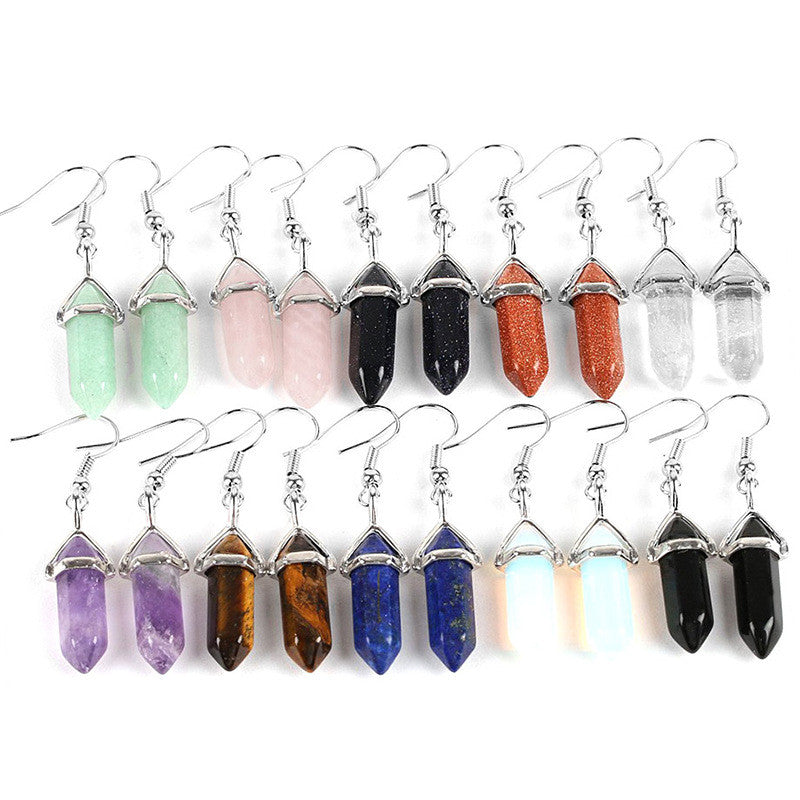 Set of crystal earrings in various colors on a white background