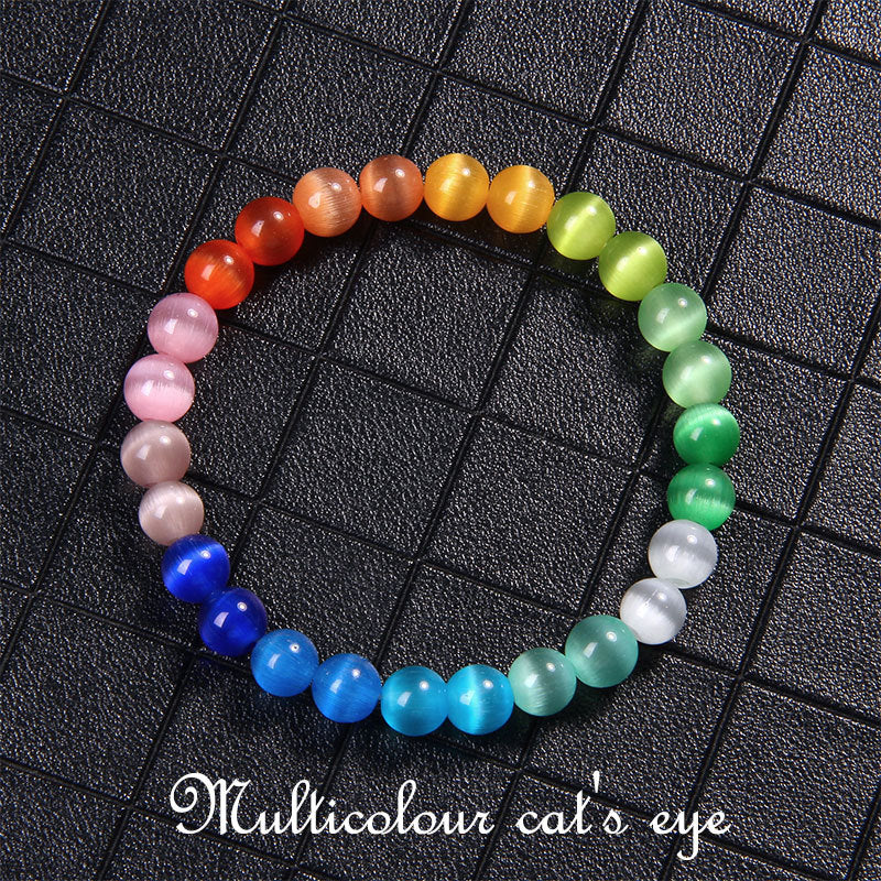 Multicolored cat's eye bracelet on a black grid background