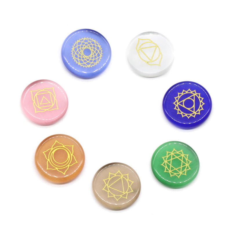 Set of colorful stones with geometric designs on a white background