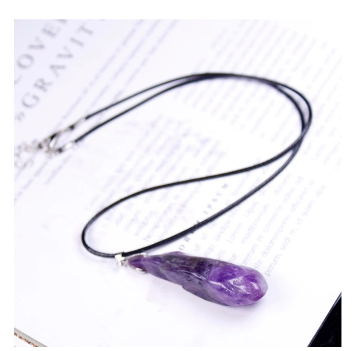 Necklace with a purple pendant on a white background