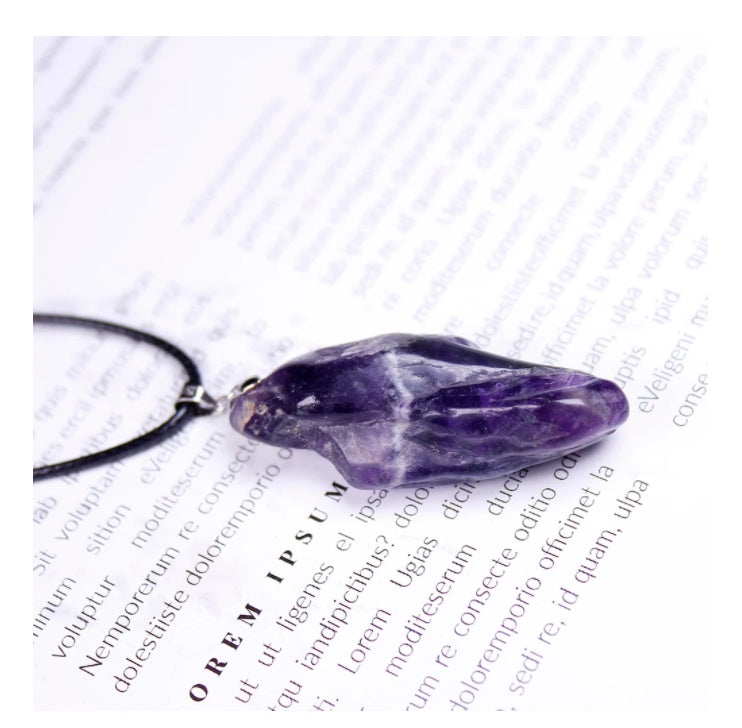 Amethyst crystal necklace on a white background with text
