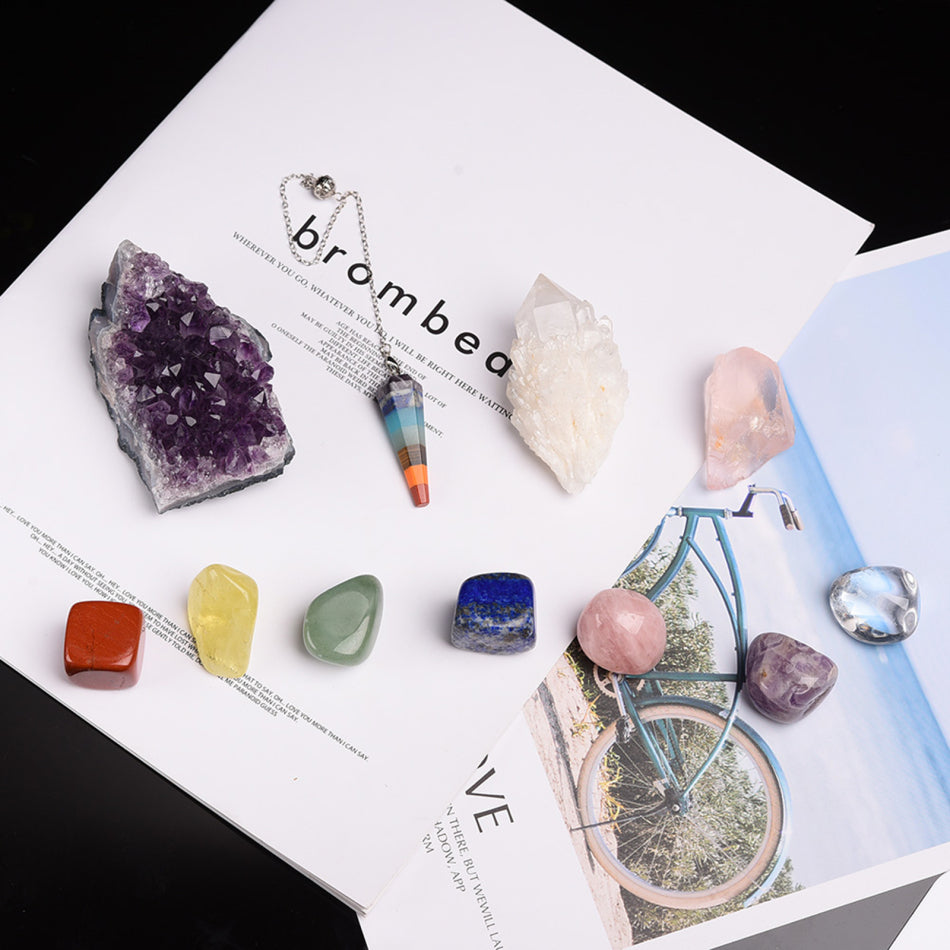 Collection of crystals and a necklace on a magazine