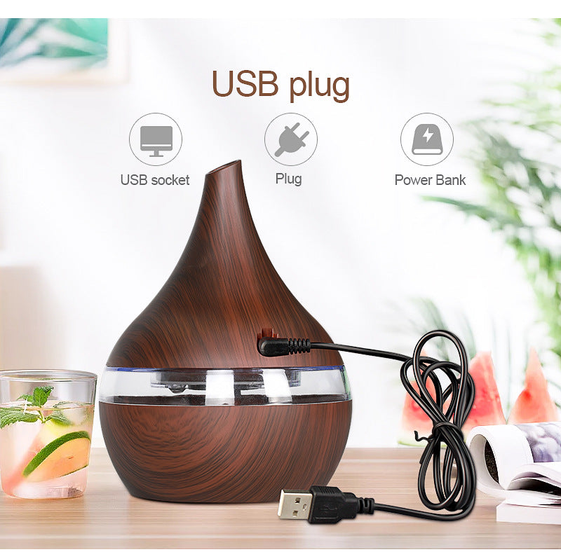Wooden-patterned humidifier with USB cable on a blurred background