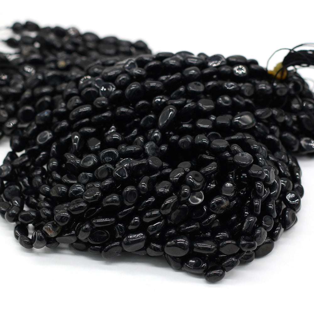String of black beads on a white background