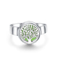 Silver ring with a green tree design on a white background