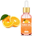 Bottle of Yoni Oil with oranges on a white background