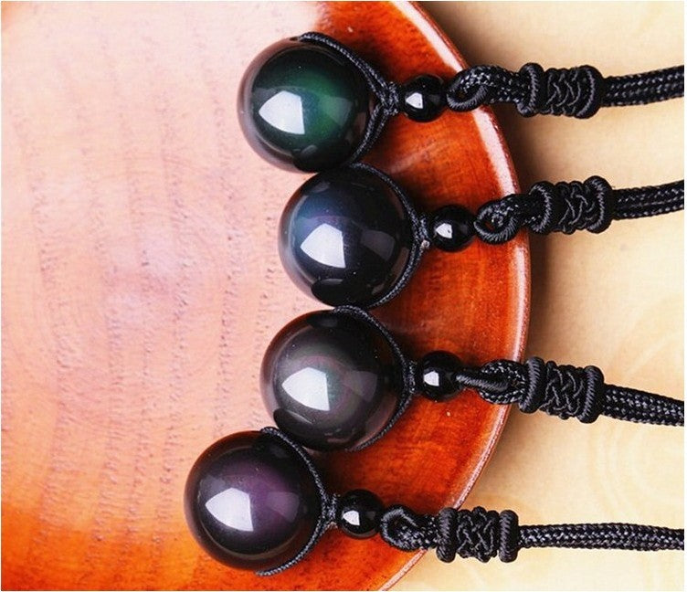Black beaded bracelets on a wooden surface