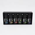 Set of Melao essential oil bottles in a black display box on a white background