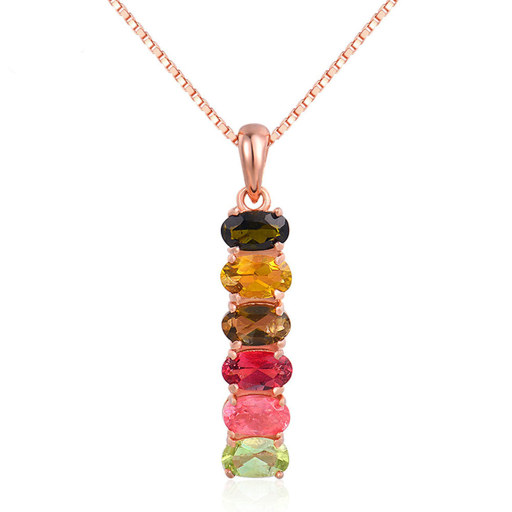 Multicolored gemstone necklace with rose gold chain on a white background