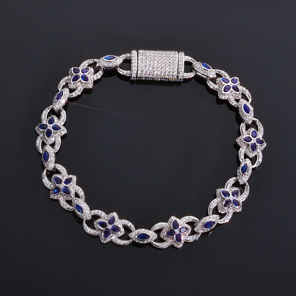 Silver bracelet with blue gemstones on a black background