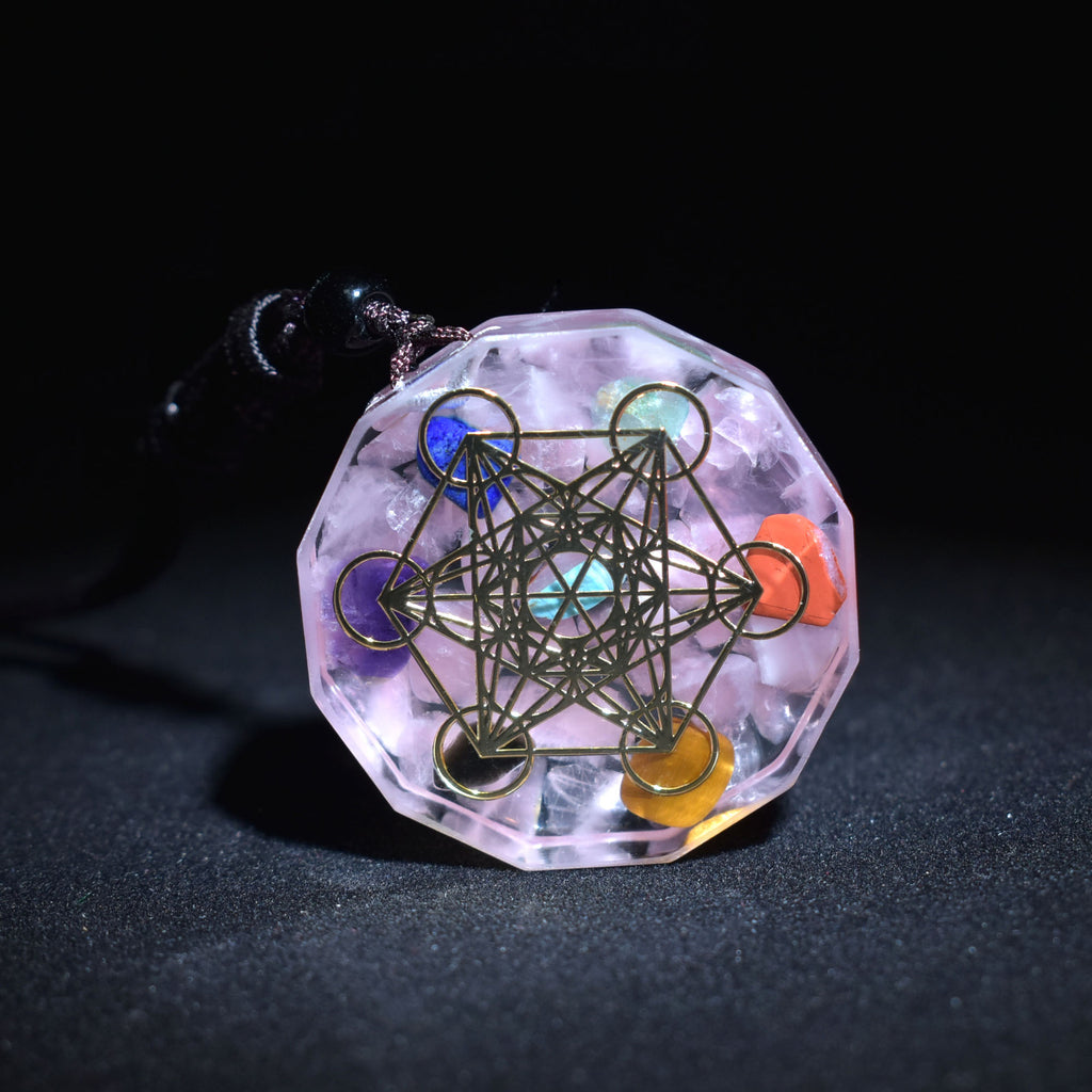Crystal pendant with geometric design on a dark background
