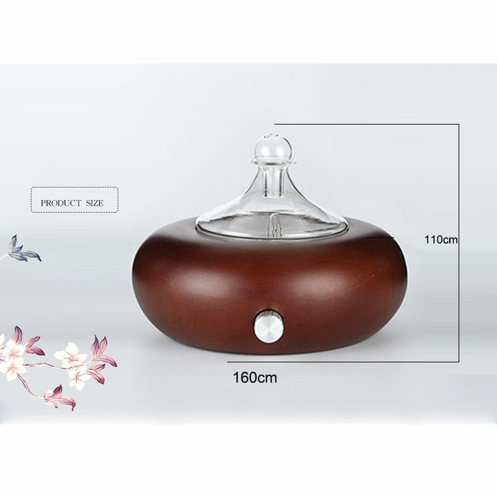 Wooden diffuser with glass top on a white background