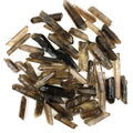 Collection of brown crystal sticks on a white background