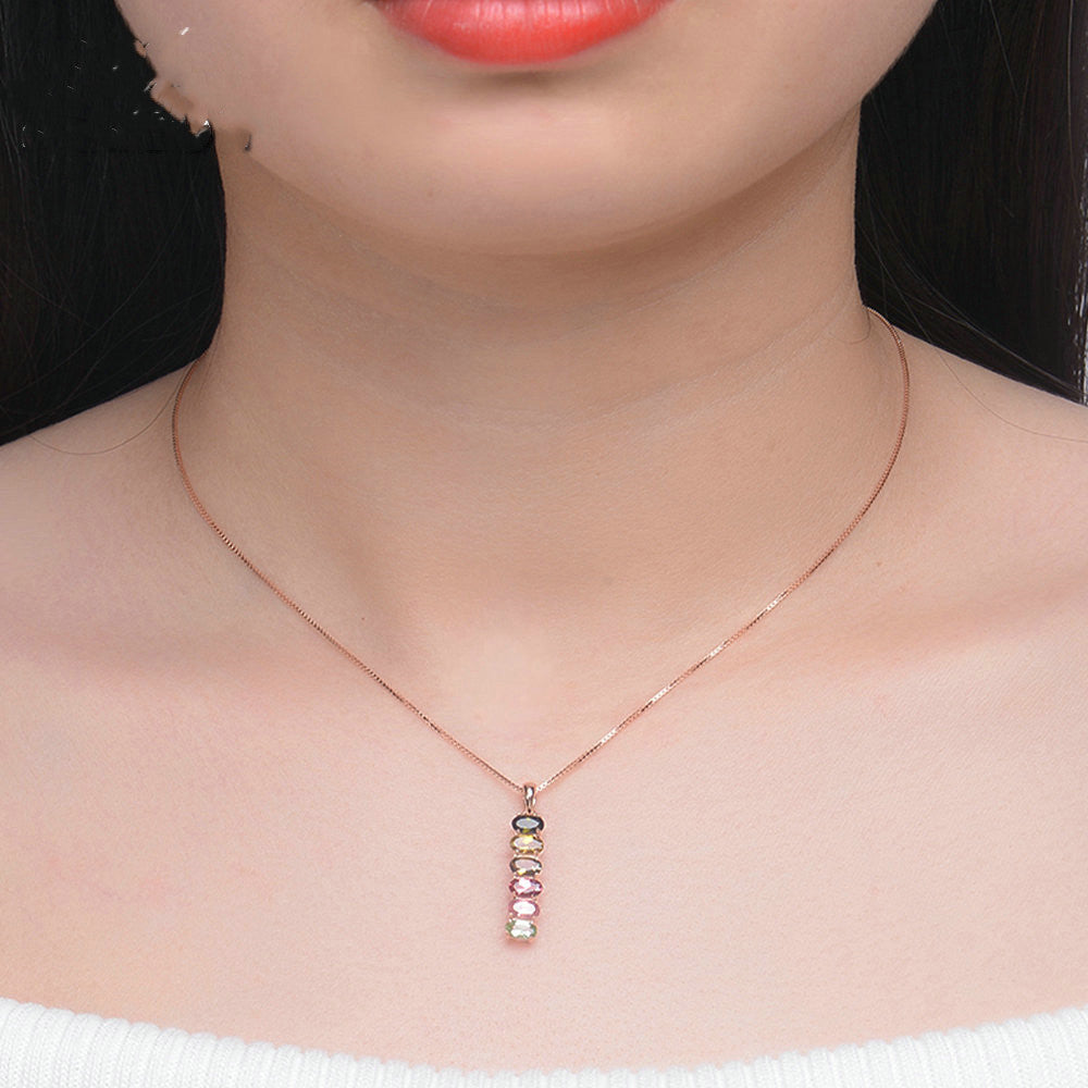 Necklace with a colorful pendant worn by a person